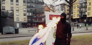 Neonazis in Finnland verbrennen israelische Flagge. Foto Screenshot Video "Kohti Vapautta!"