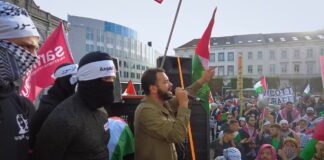 Mohammed Khatib, Europa-Koordinator von Samidoun, spricht im Namen von Masar Badil (Palästinensische Bewegung für den alternativen revolutionären Pfad) in Brüssel, Belgien, am 29. Oktober 2022. Foto Screenshot Youtube